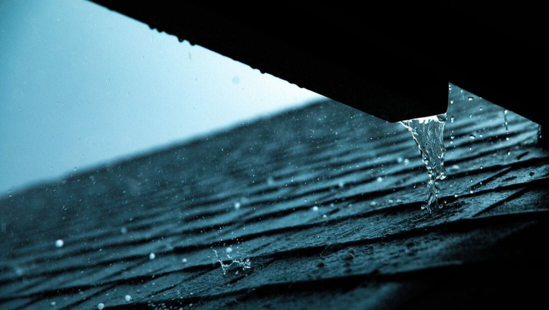 Roof and gutter during rain 